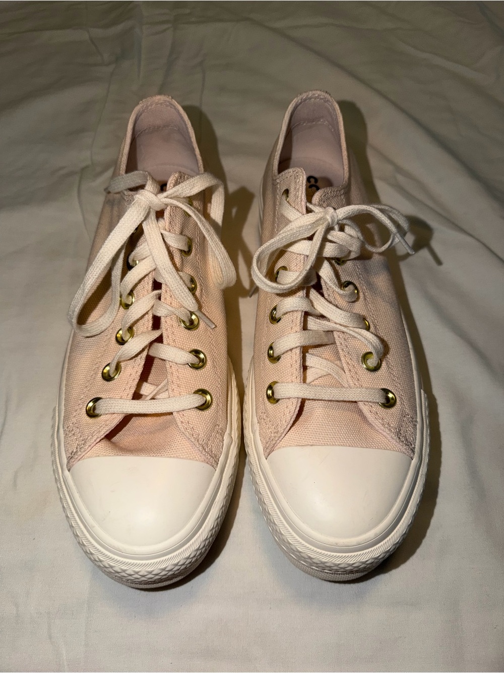 Converse Low-Top Canvas Sneakers in Light Pink with Gold Eyelets